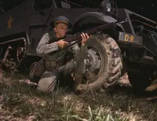 Infantryman with halftrack, a young soldier of the armed forces, holds..., Fort Knox, Ky., 1942. Creator: Alfred T Palmer