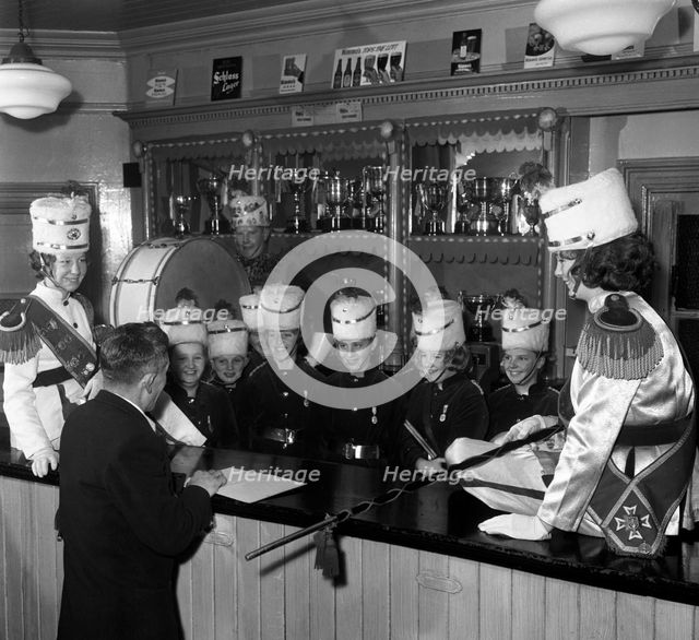Informal shot of a female marching band, Horden, County Durham, 1963.  Creator: Michael Walters.
