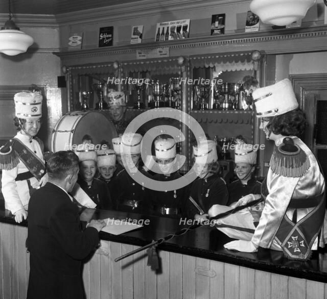 Informal shot of a female marching band, Horden, County Durham, 1963.  Artist: Michael Walters