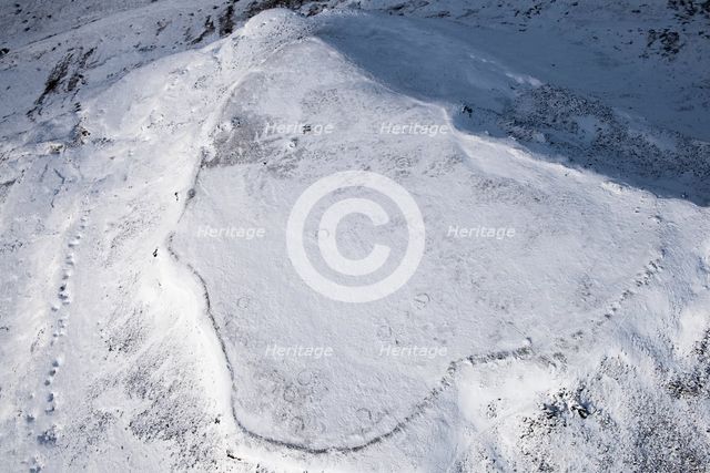 Ingleborough Iron Age univallate hillfort and hut circle earthworks in the snow, N Yorkshire, 2018. Creator: Emma Trevarthen.
