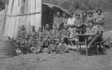 Inhabitants of One Gornaia Shoria Village and an Expedition Member, 1913. Creator: GI Ivanov