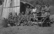 Inhabitants of One Gornaia Shoria Village and an Expedition Member, 1913. Creator: GI Ivanov