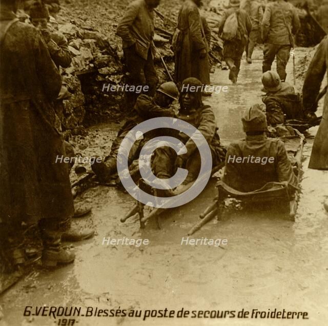 Injured soldiers at the first-aid post, Froideterre, Verdun, northern France, 1917. Artist: Unknown.