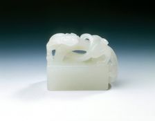 Inscribed white jade seal with arched handle and kui dragon, Ming dynasty, China, 1565