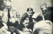 Inside a German internment camp. Americans listen to London. 1942. Creator: Unknown