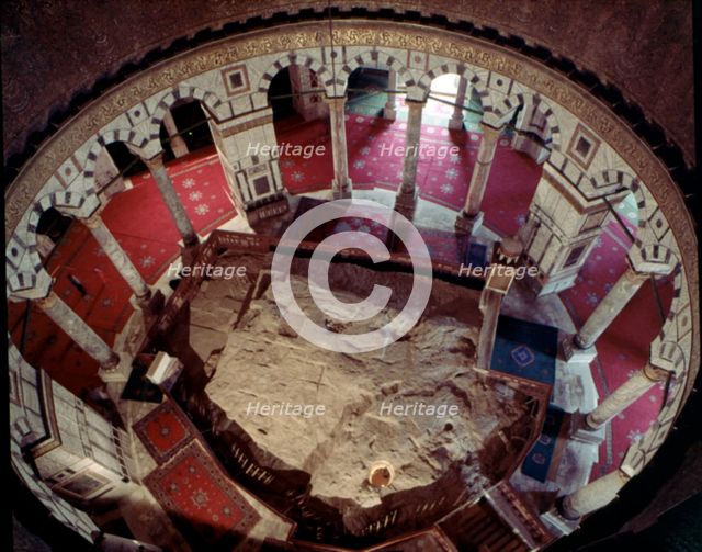 Inside the Dome of the Rock, where you can see the Rock of Abraham.