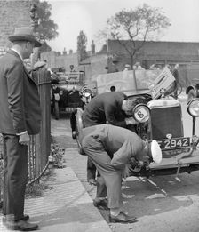 Inspecting the Star car of B Mott. Artist: Bill Brunell