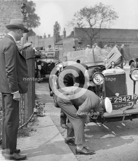 Inspecting the Star car of B Mott. Artist: Bill Brunell.