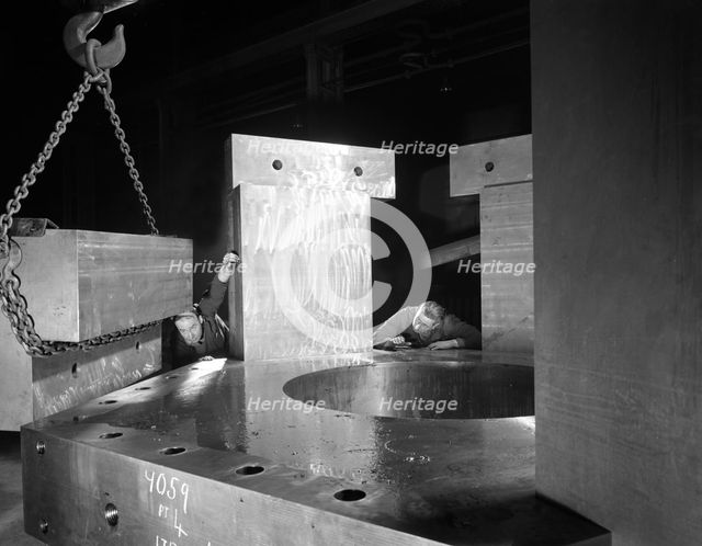 Inspecting a bubble chamber casting, Edgar Allen's steel foundry, Sheffield, South Yorkshire, 1964. Creator: Michael Walters.