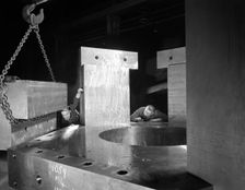 Inspecting a bubble chamber casting, Edgar Allen's steel foundry, Sheffield, South Yorkshire, 1964. Creator: Michael Walters
