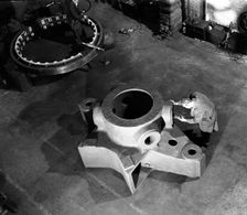 Inspecting a large precision steel casting, Sheffield, South Yorkshire, 1961. Creator: Michael Walters