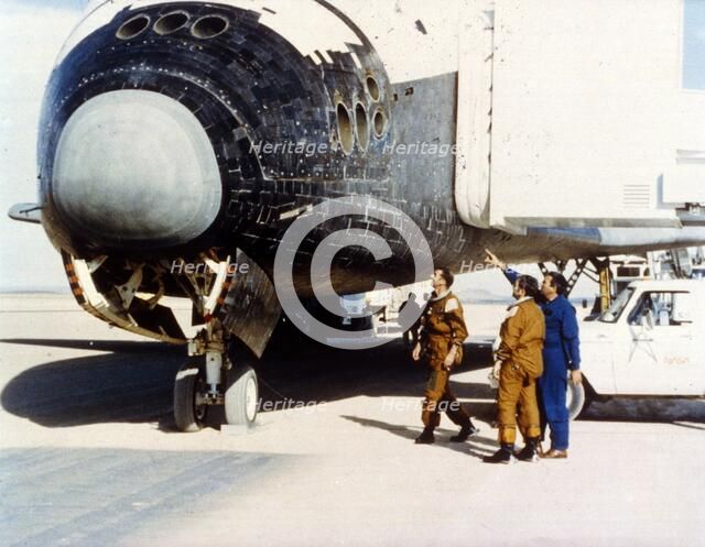 Inspecting heat tiles, second Space Shuttle flight, November 1981. Creator: NASA.