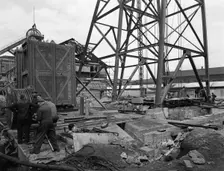Installing a cage at Hickleton Main pit, Thurnscoe, South Yorkshire, 1961. Creator: Michael Walters