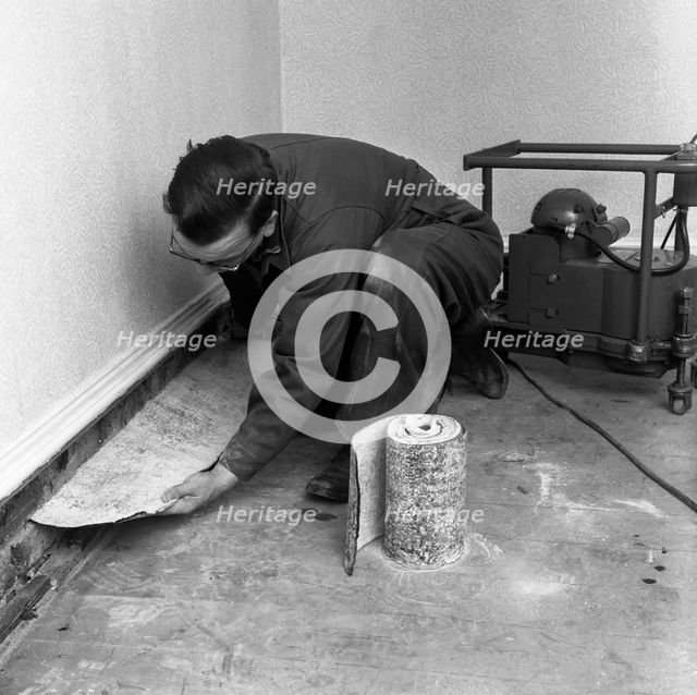 Installing a damp proof course in a house in Goldthorpe, South Yorkshire, 1957.  Artist: Michael Walters