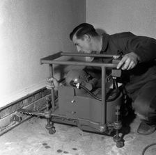 Installing a damp proof course in a house in Goldthorpe, South Yorkshire, 1957. Artist: Michael Walters