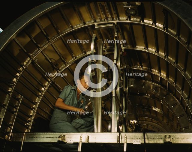 Installing oxygen flask racks above the flight...Consolidated Aircraft..., Fort Worth, Texas, 1942. Creator: Howard Hollem.