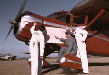 Instructor and students studying a map, Meacham Field, Fort Worth, Tex., 1942. Creator: Arthur Rothstein