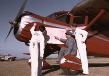 Instructor and students studying a map, Meacham Field, Fort Worth, Tex., 1942. Creator: Arthur Rothstein