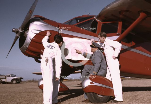 Instructor and students studying a map, Meacham Field, Fort Worth, Tex., 1942. Creator: Arthur Rothstein.
