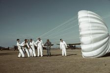 Instructor explaining the operation of a parachute to student pilots, Fort Worth, Tex., 1942. Creator: Arthur Rothstein