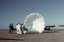 Instructor explaining the operation of a parachute to student pilots, Fort Worth, Tex., 1942. Creator: Arthur Rothstein