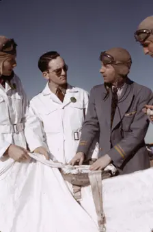 Instructor explaining the operation of a parachute to student pilots, Fort Worth, Tex., 1942. Creator: Arthur Rothstein