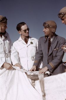 Instructor explaining the operation of a parachute to student pilots, Fort Worth, Tex., 1942. Creator: Arthur Rothstein