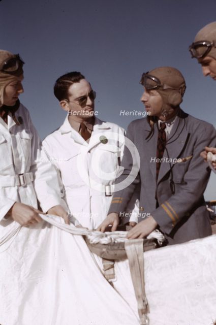 Instructor explaining the operation of a parachute to student pilots, Fort Worth, Tex., 1942. Creator: Arthur Rothstein.