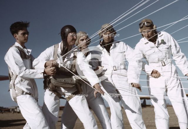 Instructor explaining the operation of a parachute to student pilots, Fort Worth, Tex., 1942. Creator: Arthur Rothstein.