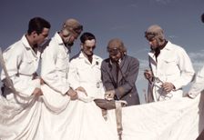 Instructor explaining the operation of a parachute to student pilots, Fort Worth, Tex., 1942. Creator: Arthur Rothstein