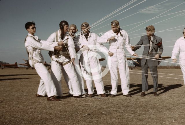 Instructor explaining the operation of the parachute to students, Fort Worth, Tex., 1942. Creator: Arthur Rothstein.