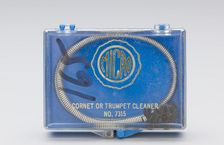 Instrument cleaning snake and case belonging to Maxine Sullivan, ca. 1936. Creator: Unknown