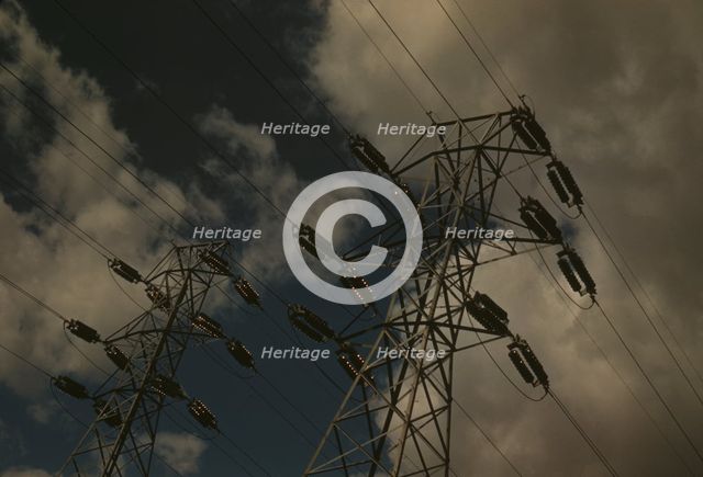 Insulators and transmission wires in the switchyard of the TVA's Chickamauga Dam..., Tennessee, 1942 Creator: Alfred T Palmer.