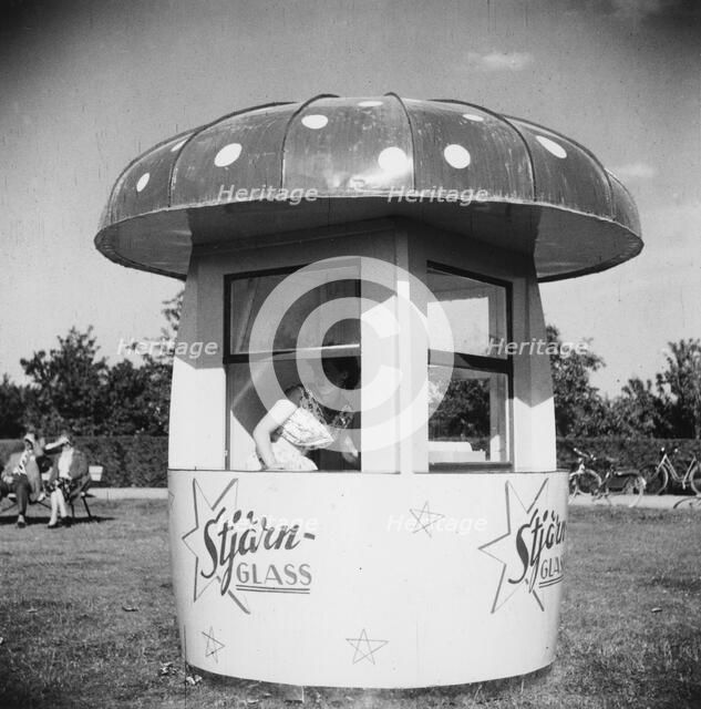 Ice cream stall shaped like a toadstool, Landskrona, Sweden, 1950. Artist: Unknown