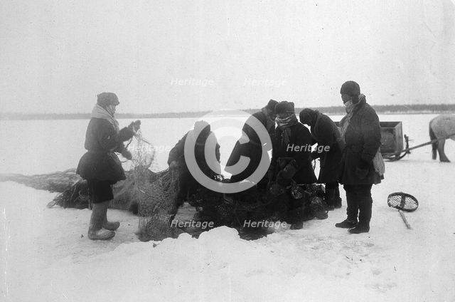Ice fishing, 1890. Creator: Unknown.