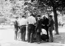 Ice water in the park--hot day, N.Y.C., between c1910 and c1915. Creator: Bain News Service