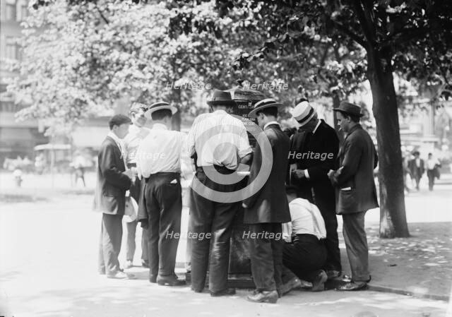 Ice water in the park--hot day, N.Y.C., between c1910 and c1915. Creator: Bain News Service.