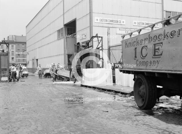 Ice which is used to store fish on boats that bring their catches into Fulton..., New York, 1943. Creator: Gordon Parks.