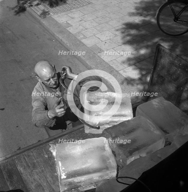 Iceman busy during the heatwave in Stockholm, Sweden, 24th July 1943. Creator: Karl Sandels.