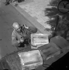 Iceman busy during the heatwave in Stockholm, Sweden, 24th July 1943. Creator: Karl Sandels