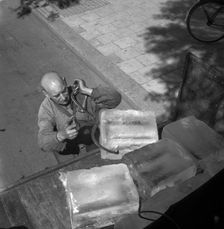 Iceman busy during the heatwave in Stockholm, Sweden, 24th July 1943. Creator: Karl Sandels