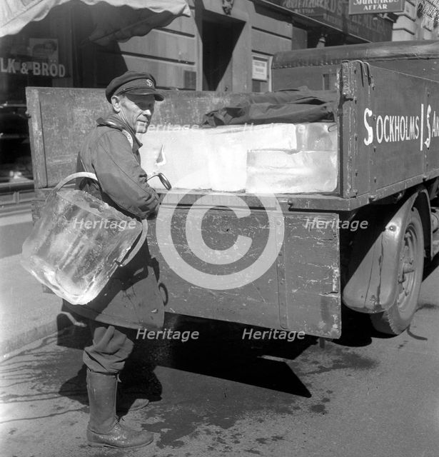 Iceman busy during the heatwave in Stockholm, Sweden, 24th July 1943. Creator: Karl Sandels.