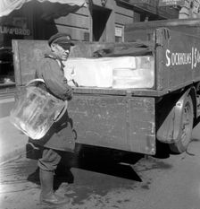 Iceman busy during the heatwave in Stockholm, Sweden, 24th July 1943. Creator: Karl Sandels