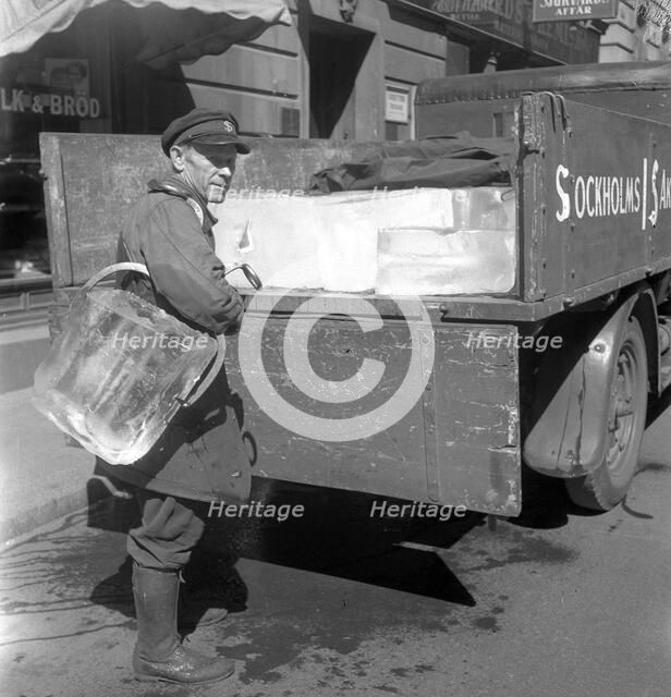 Iceman busy during the heatwave in Stockholm, Sweden, 24th July 1943. Artist: Karl Sandels