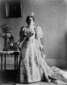 Ida S. McKinley, full-length portrait, standing, facing front, between 1890(?) and 1900(?). Creator: Frances Benjamin Johnston