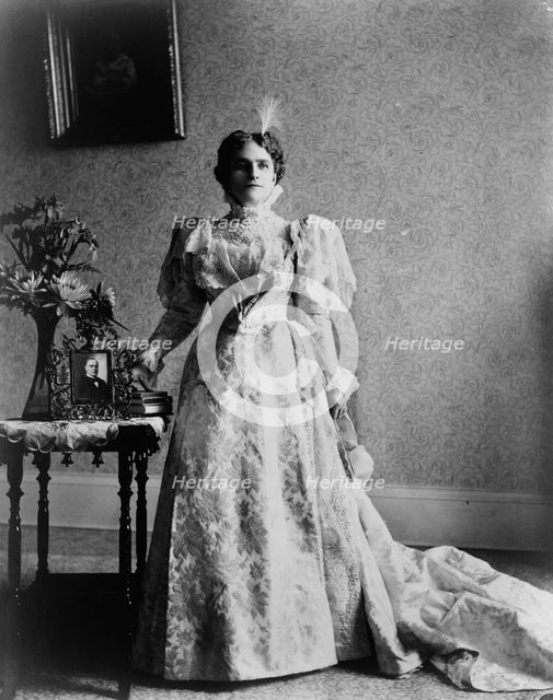 Ida S. McKinley, full-length portrait, standing, facing front, between 1890(?) and 1900(?). Creator: Frances Benjamin Johnston.