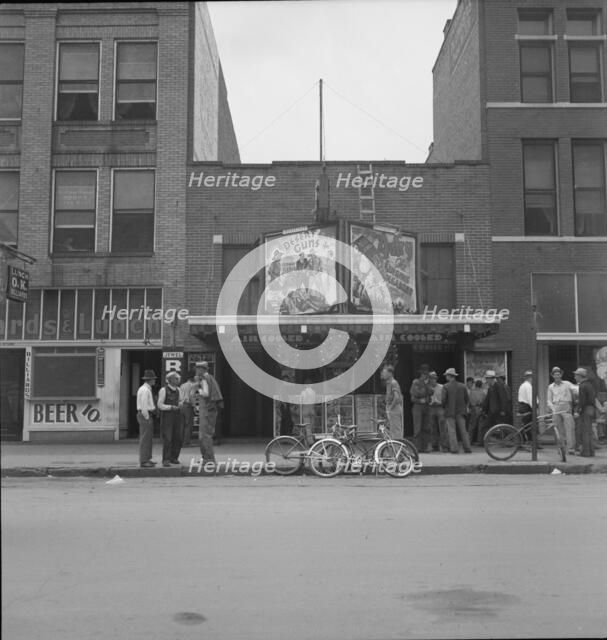 Idle men attend the morning movies, Oklahoma City, Oklahoma, 1937. Creator: Dorothea Lange.
