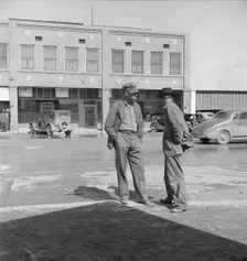 Idle pea pickers discuss prospects for work, Calipatria, Imperial Valley, CA, 1939. Creator: Dorothea Lange
