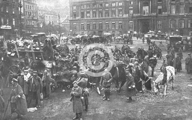 'Ils S'en Vont; Unrassemblement allemand sur la place Saint-Lambert, a Liege; au fond..., 1918. Creator: Unknown.