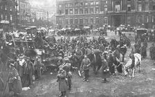 Ils S'en Vont; Unrassemblement allemand sur la place Saint-Lambert, a Liege; au fond..., 1918. Creator: Unknown